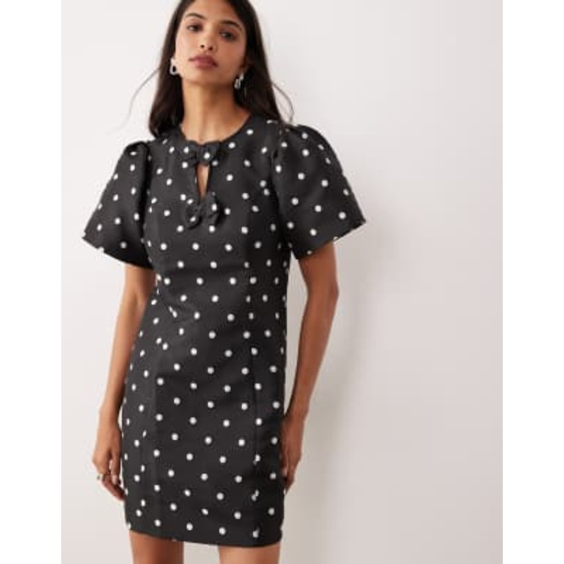 YAS puff sleeve structured mini dress in black & white polka dots