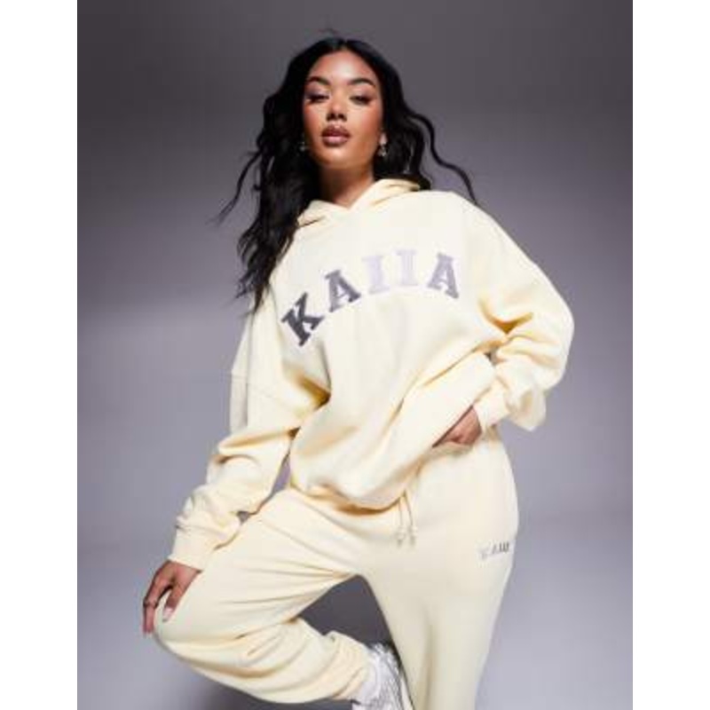 Kaiia cotton blend embroidered logo hoodie in soft yellow and dark gray – part of a set