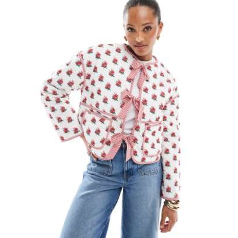 The Frolic exclusive quilted bow tie front reversible jacket in cream floral and red stripe
