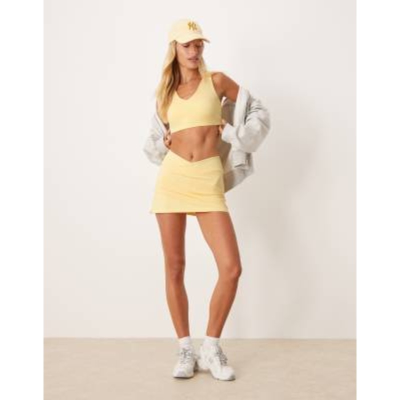 4505 wrap waist tennis skirt with under shorts and phone pocket in pale yellow