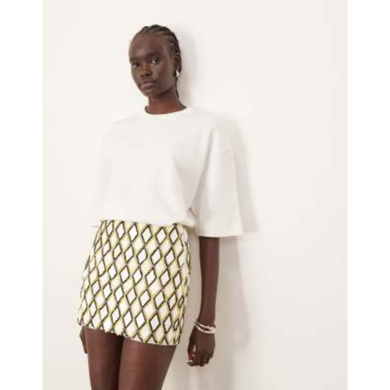 ARRANGE geometric grid embellished mini skirt in white