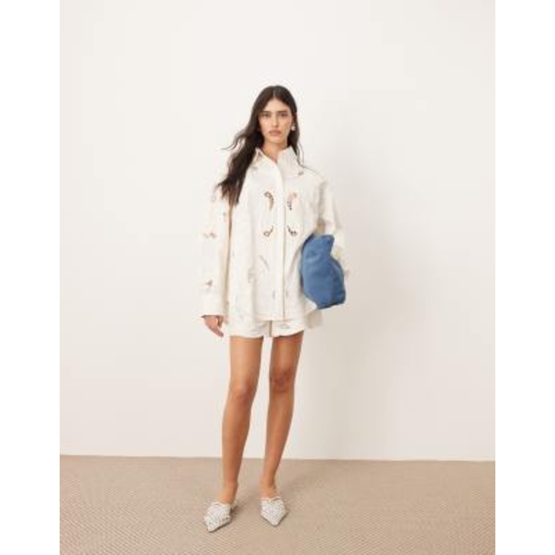 ARRANGE cotton mirrored floral embroidered cutwork shirt and shorts set in white