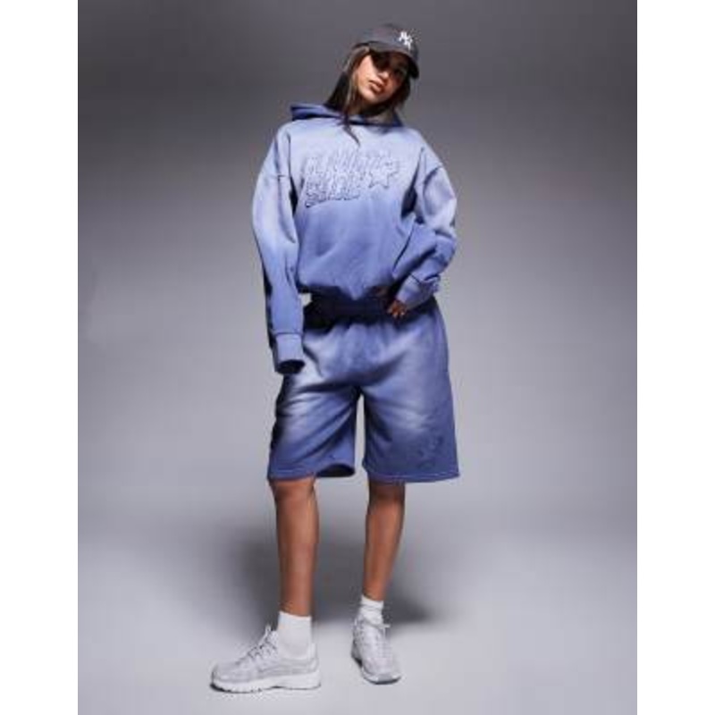 Courtside logo detail relaxed raw hem shorts in washed blue – part of a set