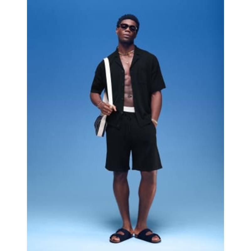 DESIGN oversized textured polo shirt and shorts set in black