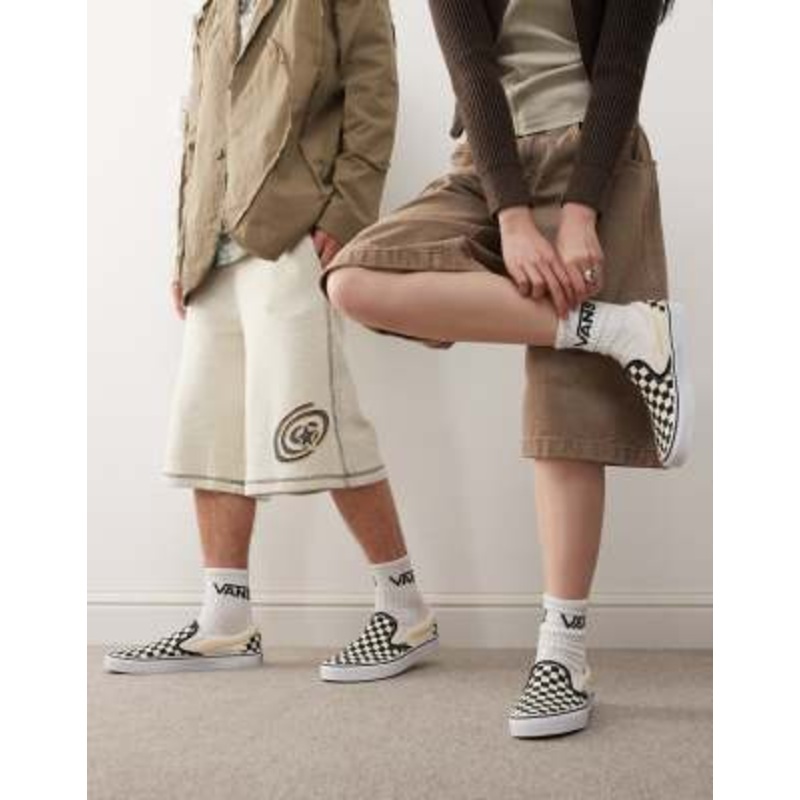 Vans Slip-On checkerboard sneakers in black and white