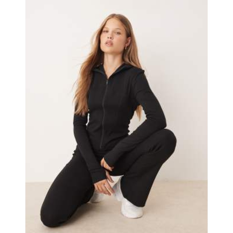 Gina Tricot sculpting zip up athletic jacket and high waist flare pants set in black