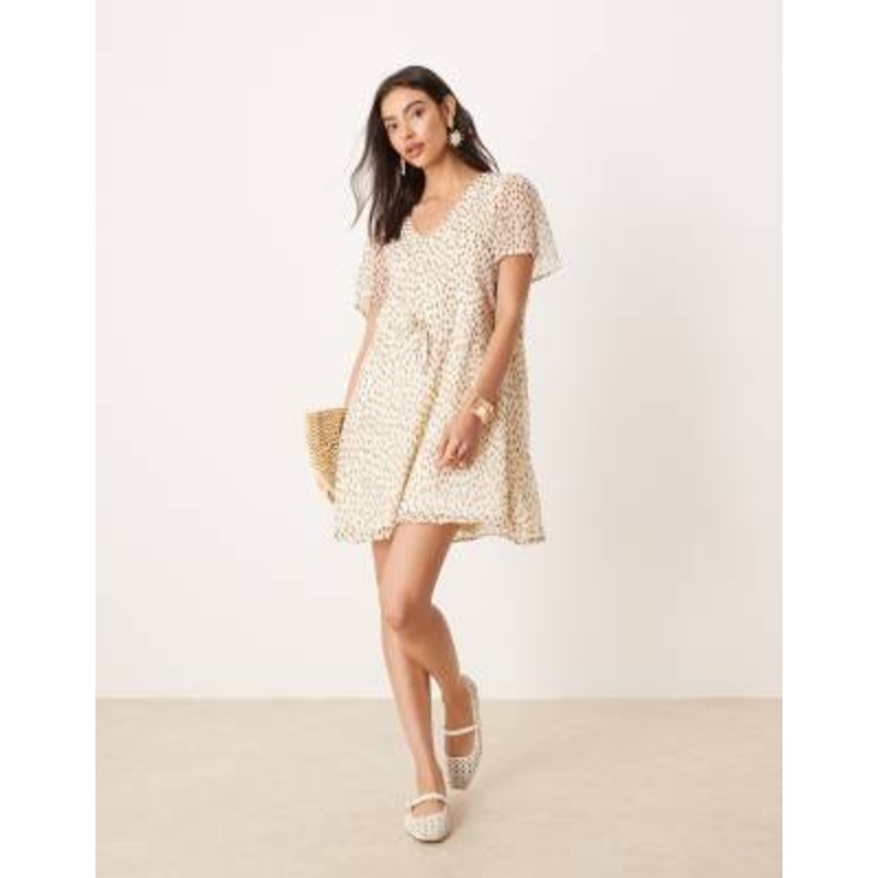 VILA tie waist mini dress in cream spot print