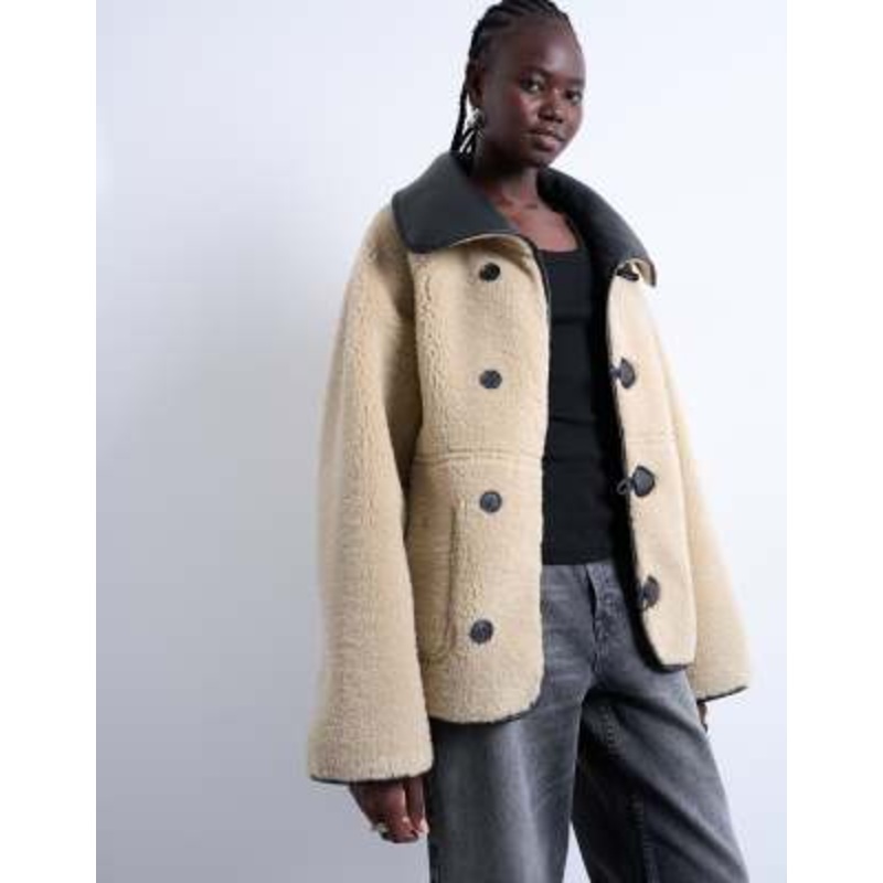 Topshop faux shearling oversized reversible coat with button loops in black and cream