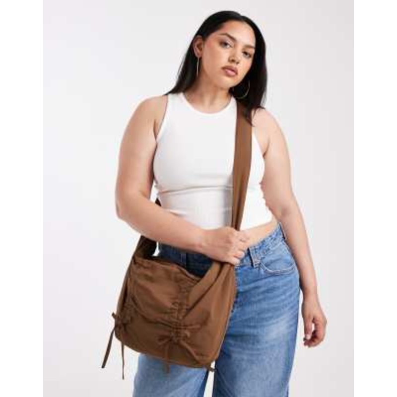 Pieces cross body bag with bow details in brown