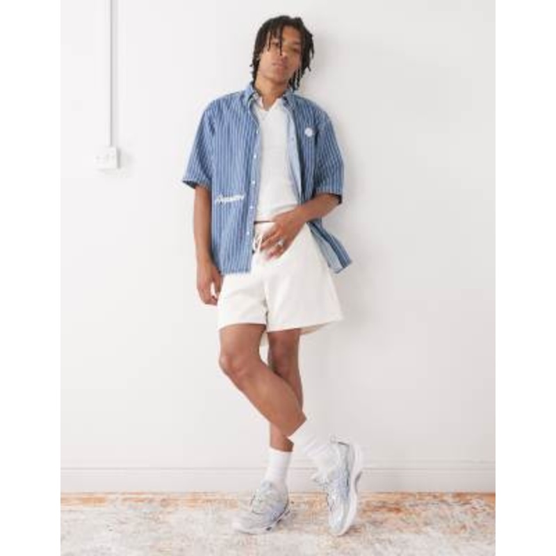 Reclaimed Vintage baggy fit shorter length pull on chino shorts in ecru