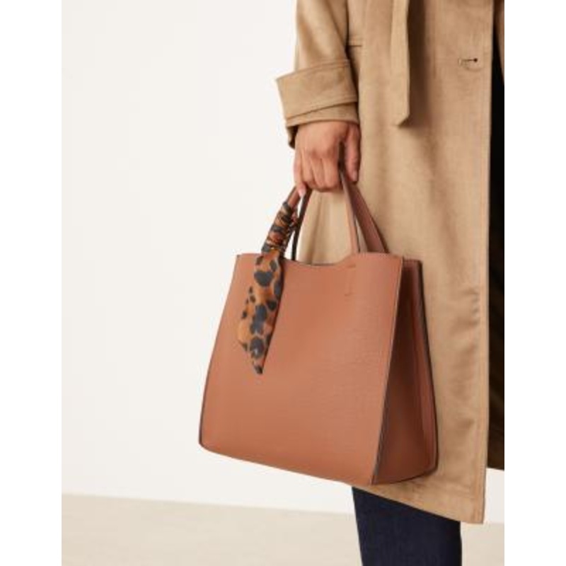Accessorize handheld box bag with leopard print scarf in tan