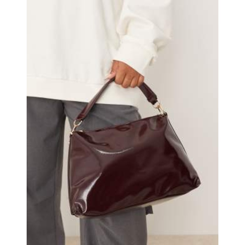 Accessorize patent slouchy handheld bag in burgundy