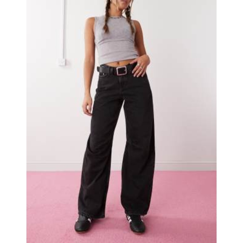 Weekday Oblique v shaped low waist barrel leg jeans with slight distressed effect in washed black