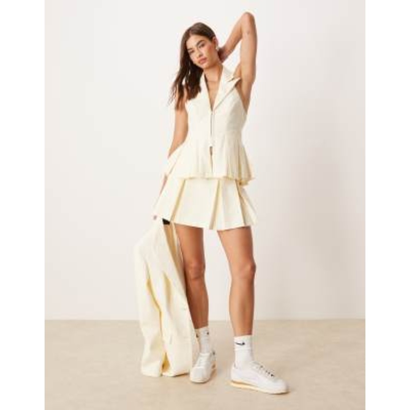 LUXE tailored pleated mini skort and cinched vest set in buttermilk pinstripes